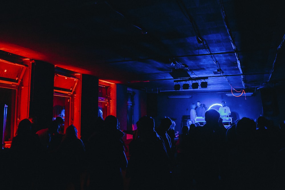 group of people in dim room