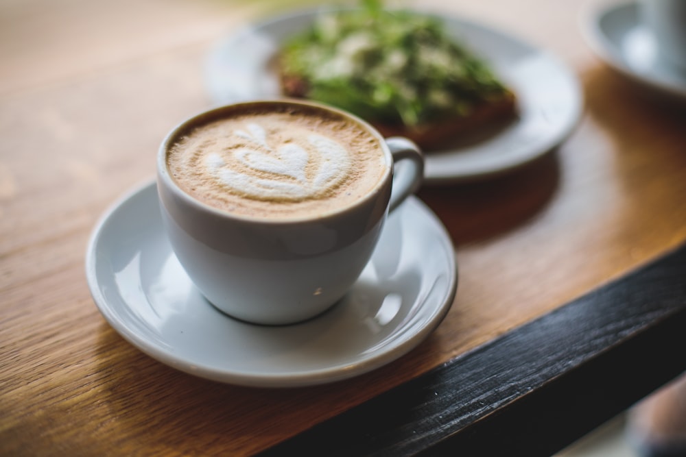 white ceramic teacup with saucer