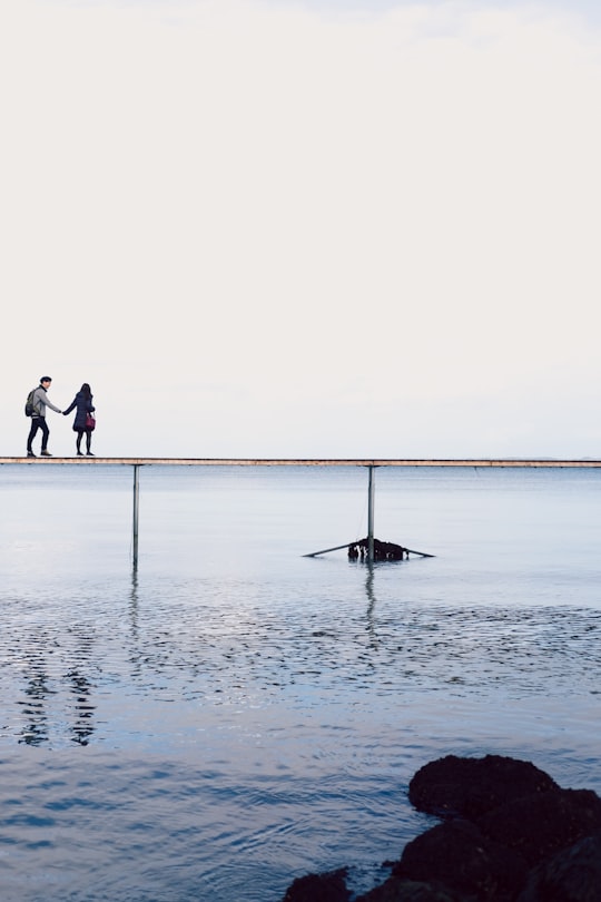 man holding woman's hand during daytime in Aarhus Denmark