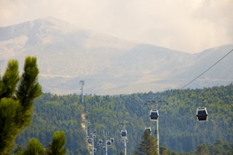 black cable carts on mountain at daytime