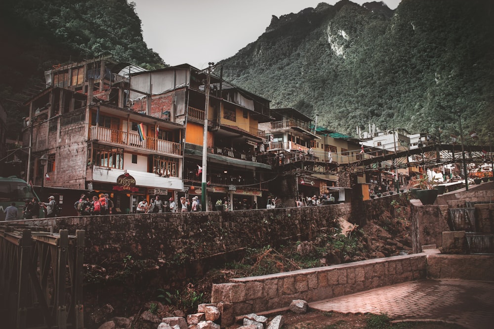 multicolored painted city buildings near green mountain