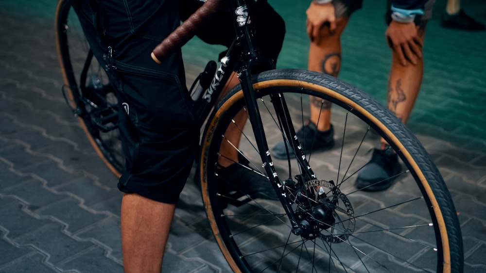 person riding on black bicycle