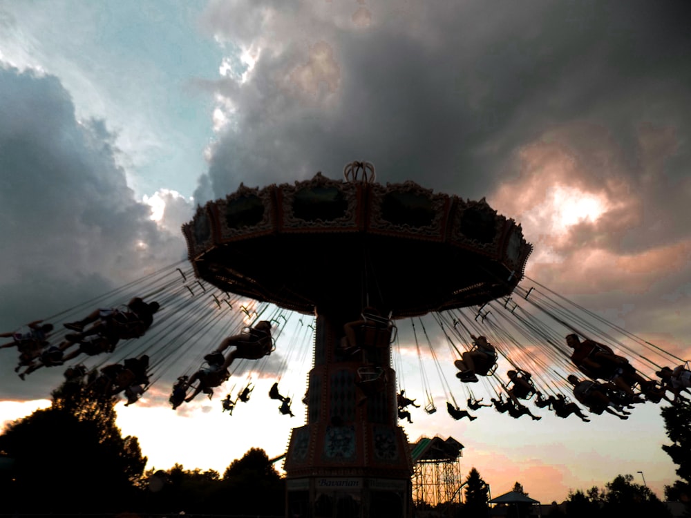 beige carousel under cumulud clouds