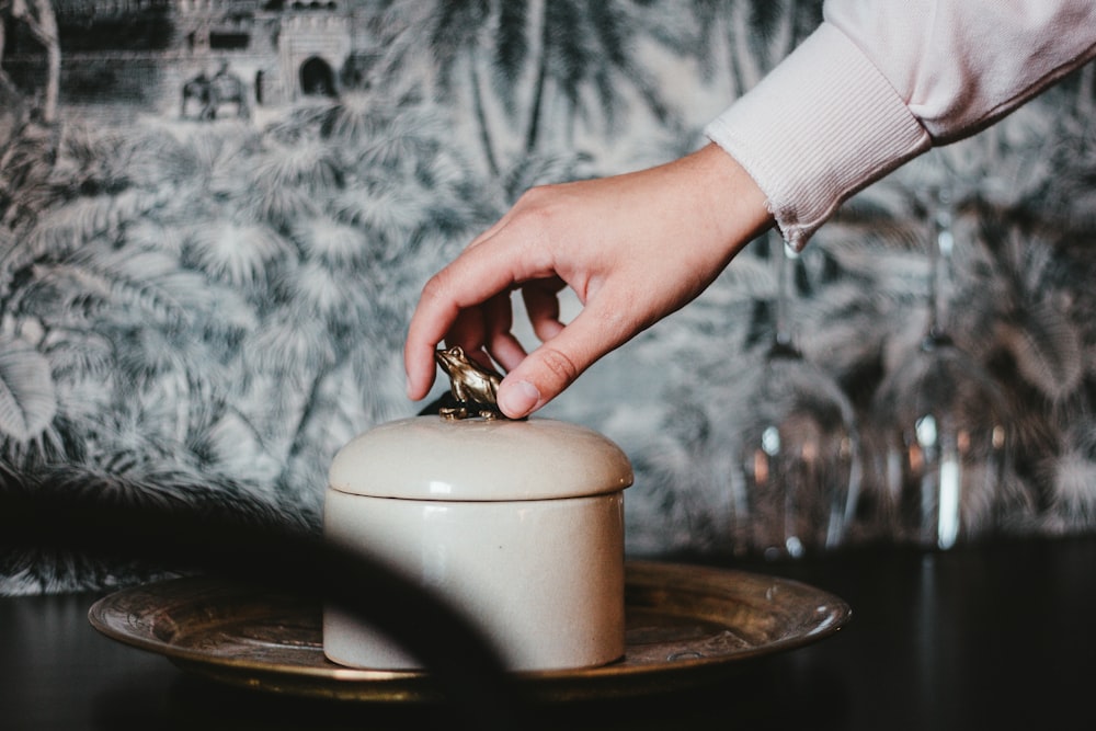 white ceramic jar with lid