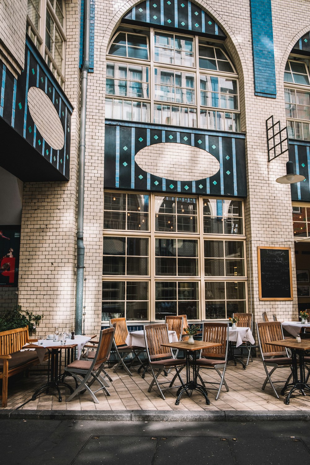 white restaurant with tables and chairs