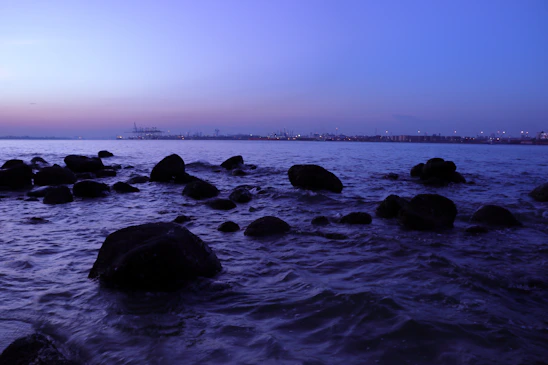a calm dusk view over the atlantic ocean with a dark horizon and gentle coastal textures
