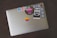 A colorful laptop covered in various stickers and decals.