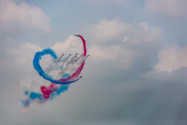 A fleet of drones forming heart shapes against a starlit sky during a wedding celebration.