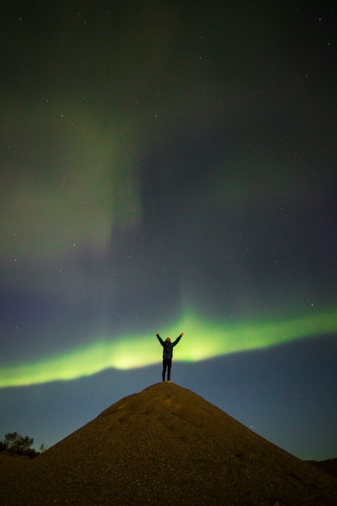 person standing at the top of hill