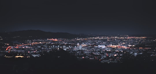 city skyline photography during nighttime in Linz Austria