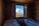 A cozy hotel room with a view of the mountains.