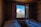 A cozy hotel room with a view of the mountains.