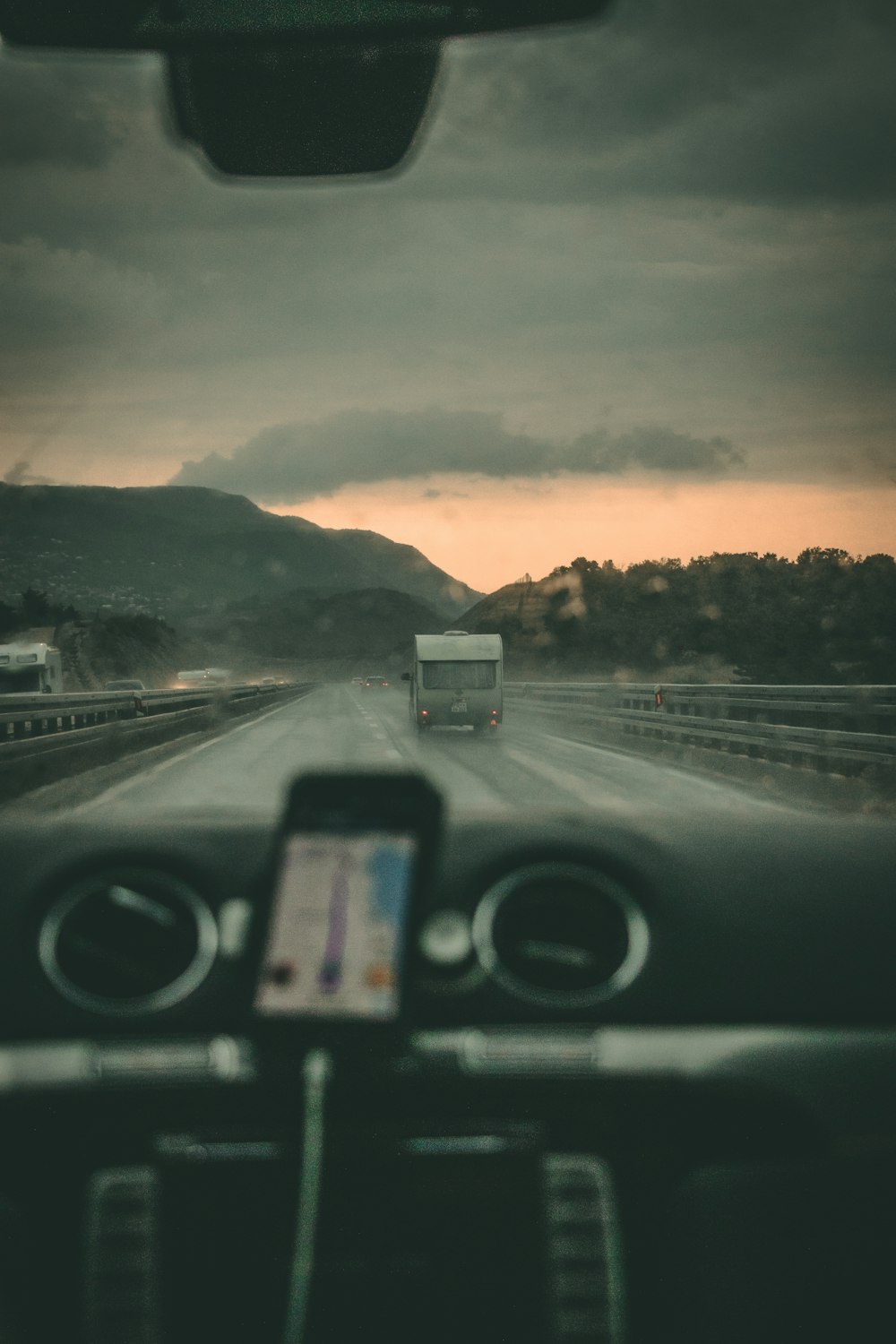 person riding car near mountain range