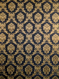 Elegant golden wayang gunungan illustration centered on deep navy blue background.