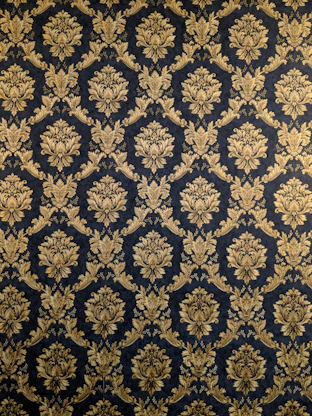 Elegant golden wayang gunungan illustration centered on deep navy blue background.