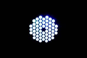A circular arrangement of small, brightly lit LED lights against a black background. The LEDs emit a cool blue-white light and are tightly packed in a symmetrical pattern.