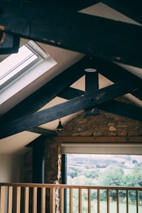 Interior view of a renovated rustic living room with natural light