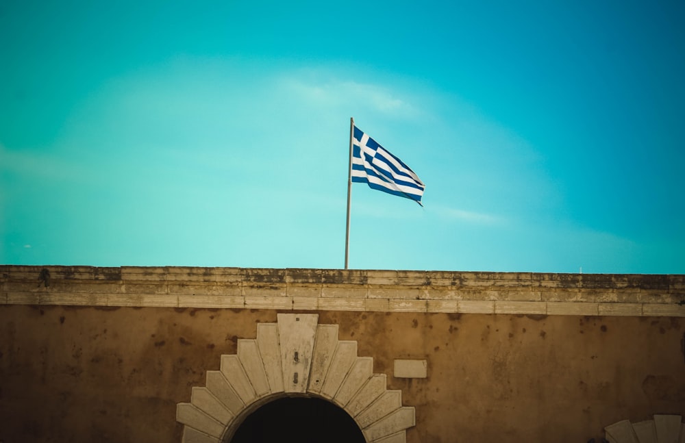 flag of Greece hoisted on pole
