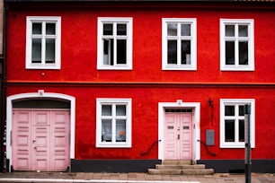pink wooden double doors are closed