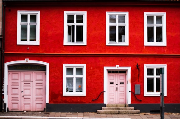pink wooden double doors are closed