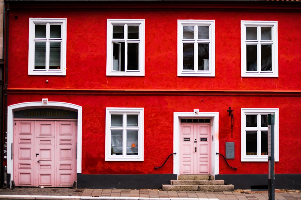 pink wooden double doors are closed