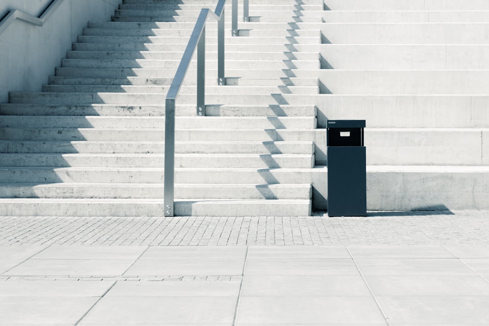 black box near gay concrete stairs