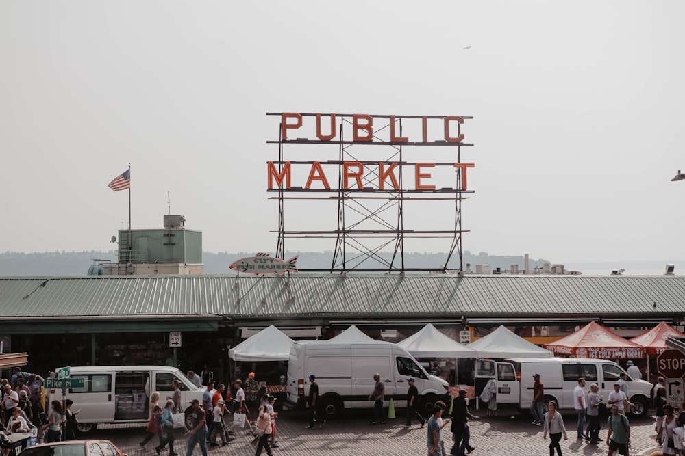 people walking in front of Public Market during daytime