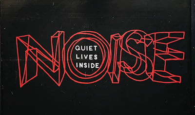 Noise text over black background