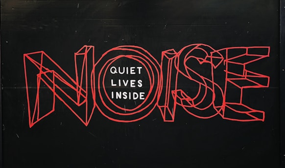 Noise text over black background