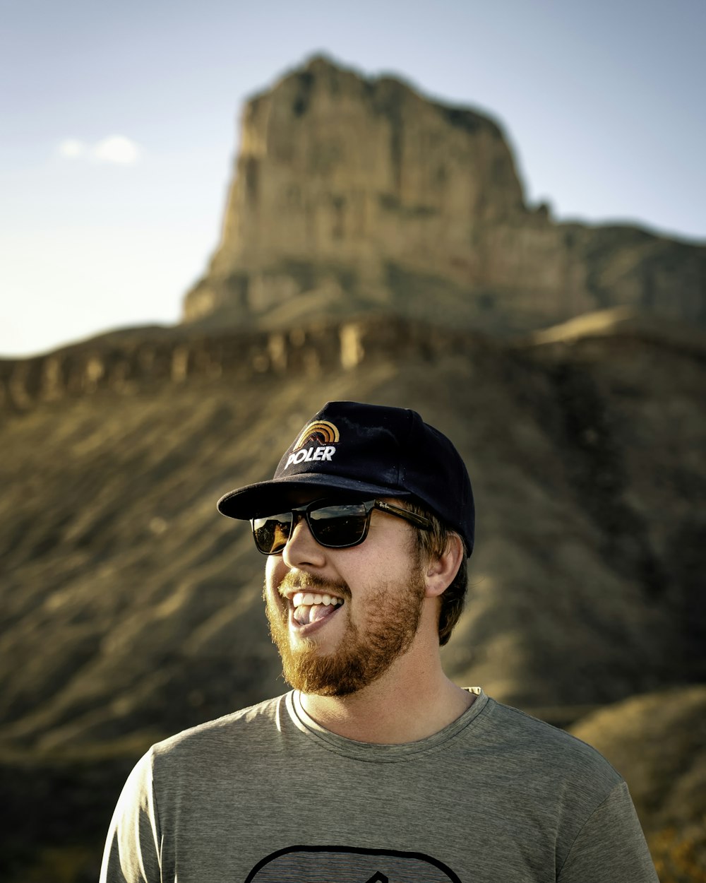 man showing tongue outdoor during daytime