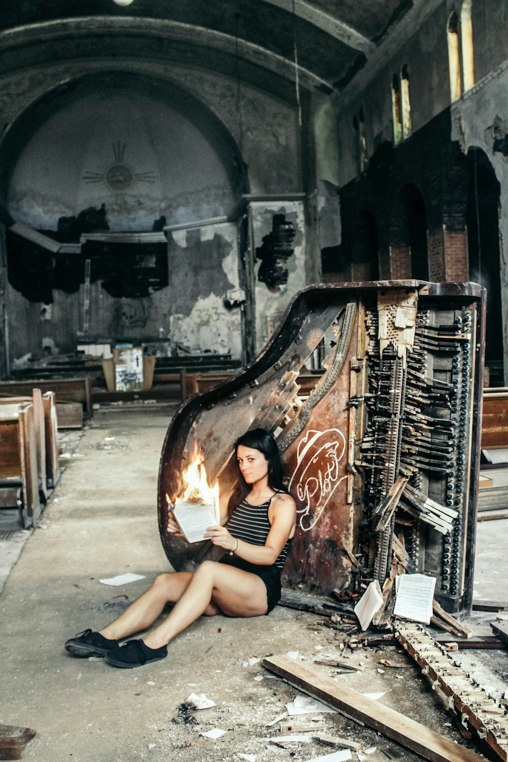 woman sitting behind piano