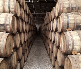 pile brown barrels inside building