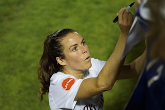 An artist signing a licensing agreement with a Zaventra Music representative.