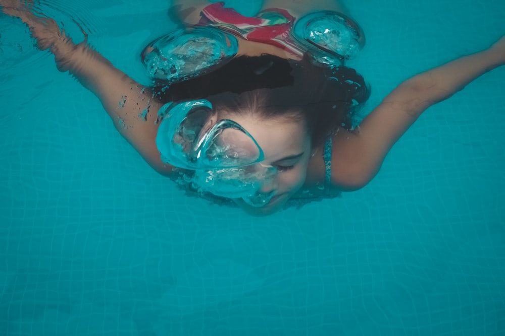 woman swimming under water