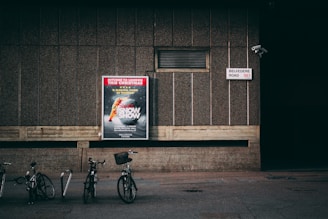 bicycle parked near concrete wall