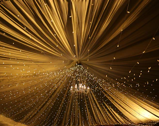 An elegant restaurant ceiling with a combination of fiber optic lighting and acoustic solutions enhancing ambiance.