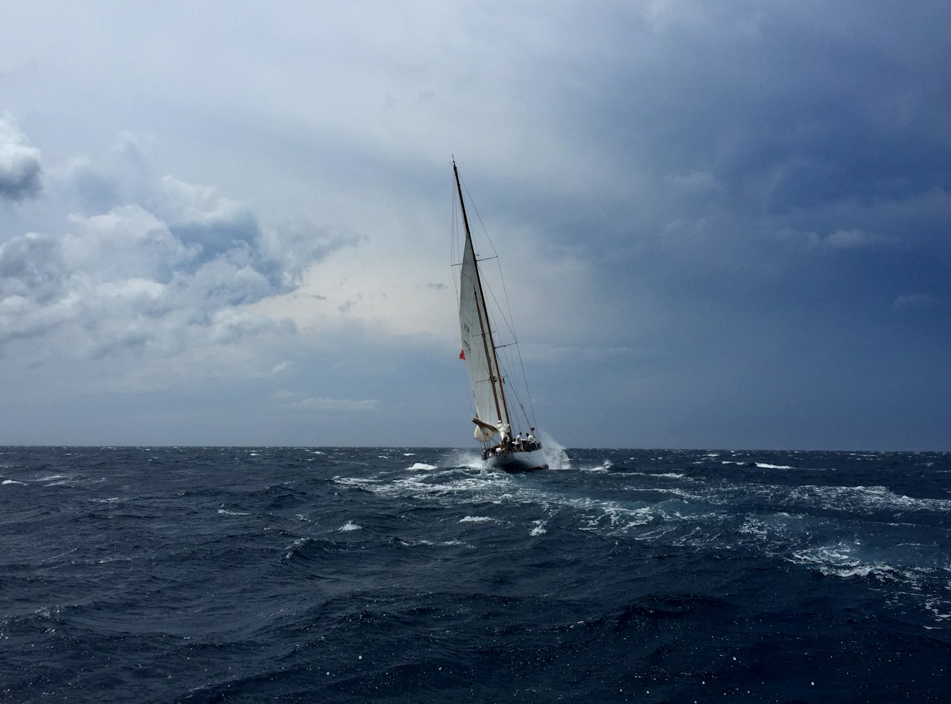 Boat navigating weather and stormy seas