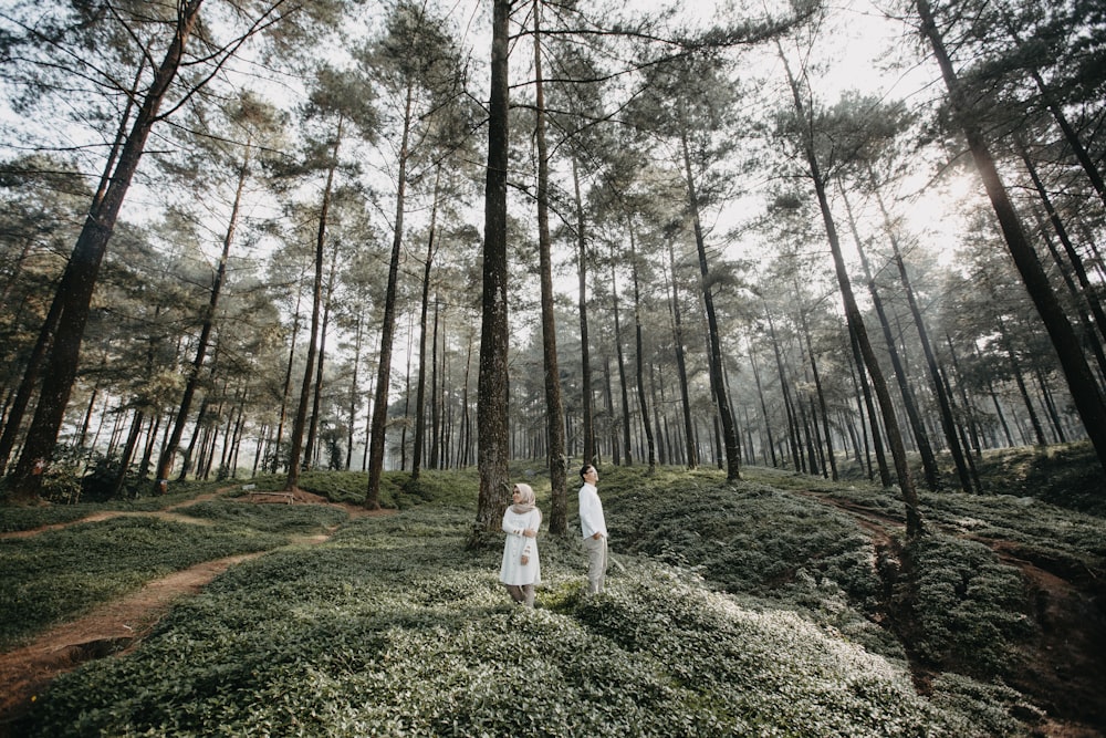 man and woman inside forest