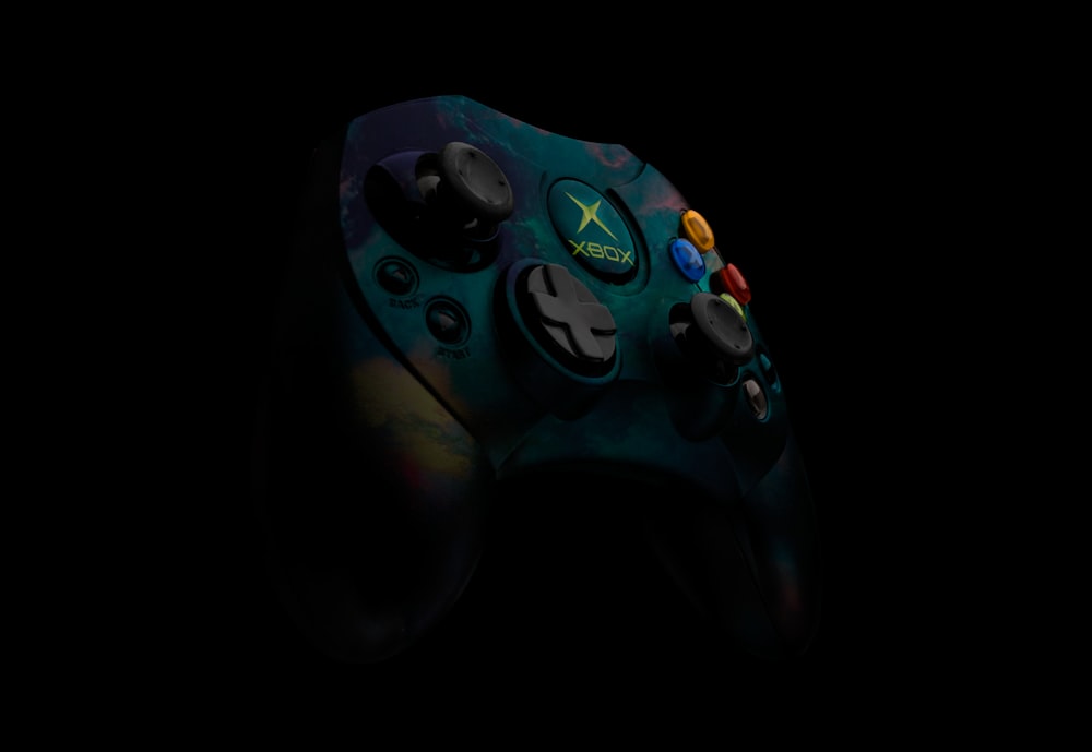 teal and black Xbox Original controller