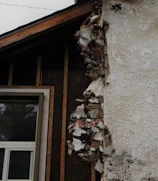 Photo of a residential home with a recently removed load-bearing wall showing exposed framing.