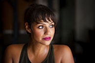 woman in black tank top standing in room