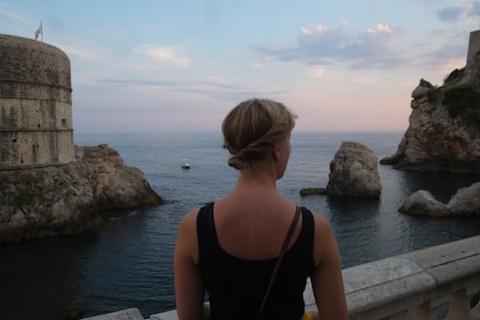 women's black sleeveless scoop-neck top in Muralles de Dubrovnik Croatia