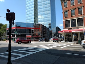 An aerial view of multiple Dunkin' Donuts locations owned by Cafua Realty Trust CLXI across a cityscape.