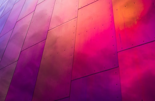 Vibrant paint being applied to steel panels, creating a smooth and glossy finish.