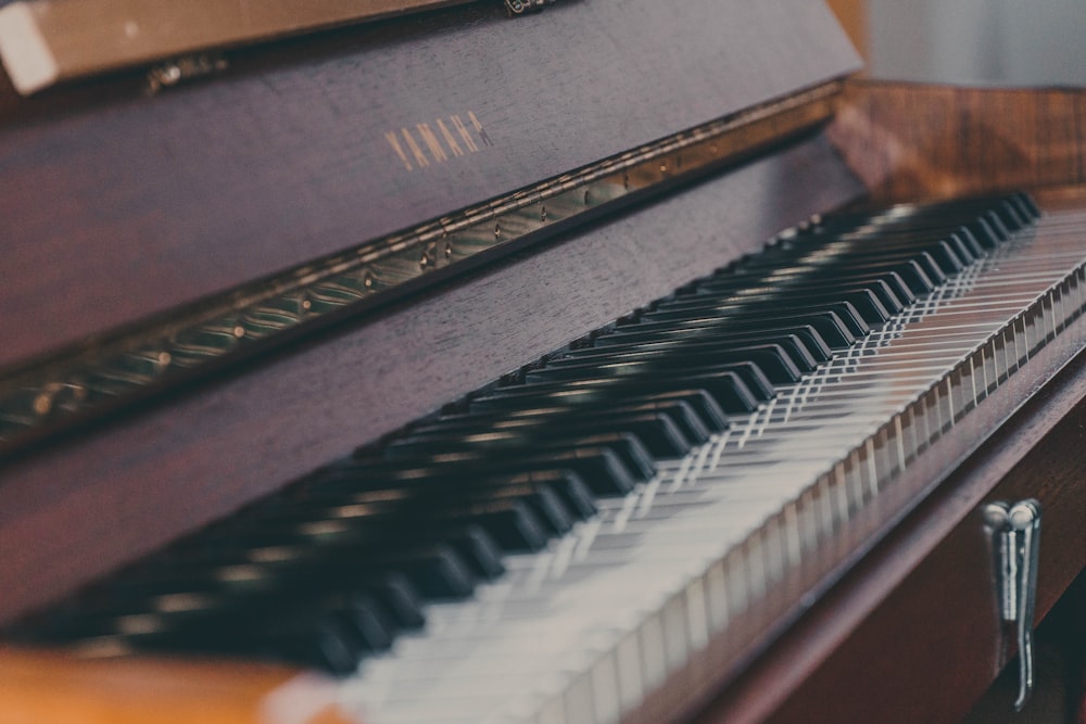 brown wooden spinet piano