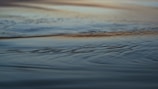 A serene scene featuring a scarf gently resting on a water surface.