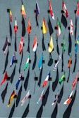 photo of assorted-color nation flags on wall during daytime