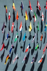 photo of assorted-color nation flags on wall during daytime