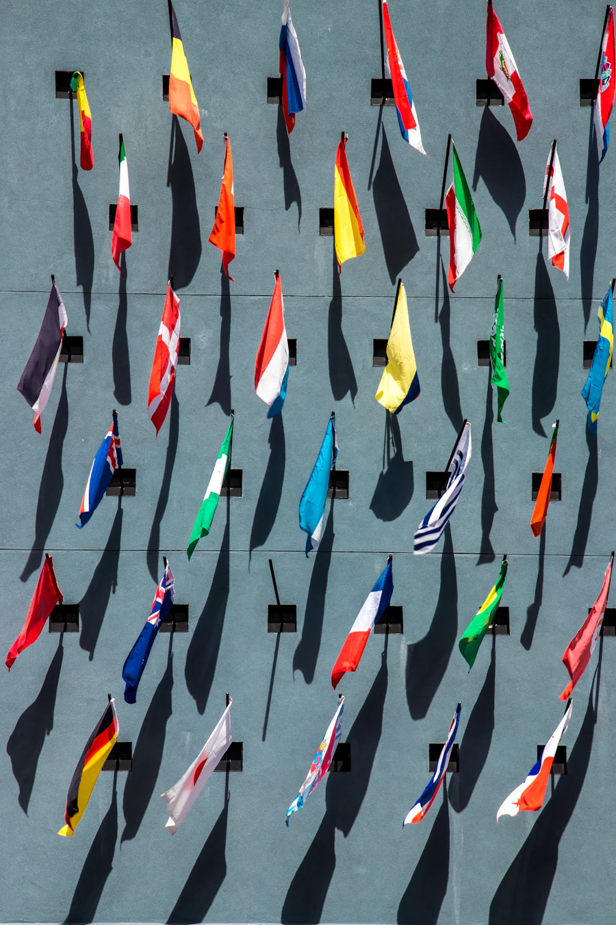 Flags of many nations on a wall