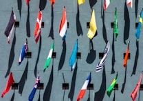 photo of assorted-color nation flags on wall during daytime